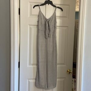 Spaghetti strap jumpsuit. White with blue strips.